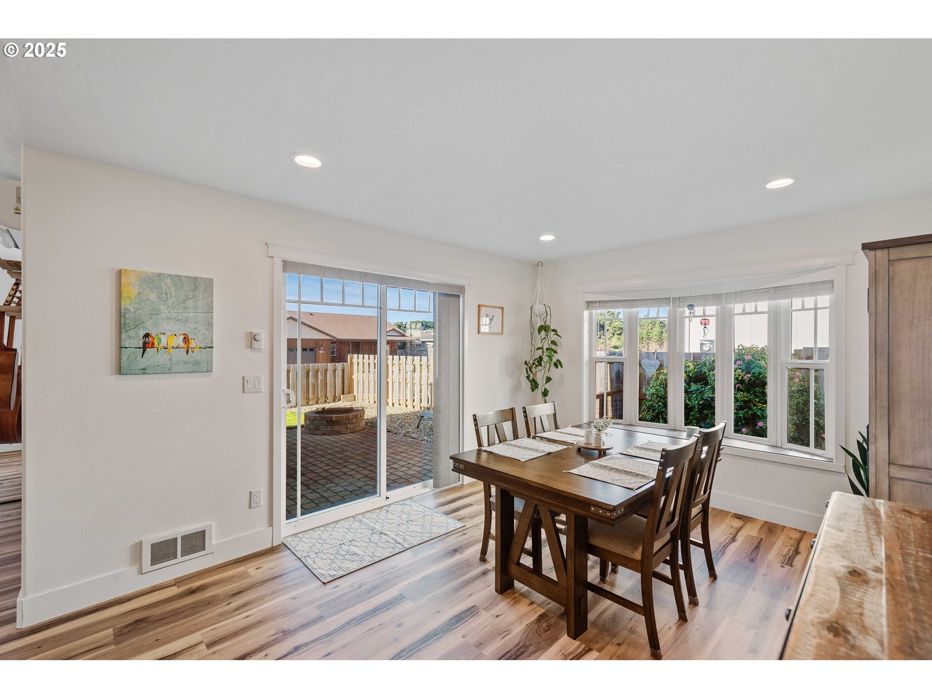 2669 Cedar Loop Bandon, OR 97411 - Photo 15 of 48 a view of a dining room with furniture window and outside view