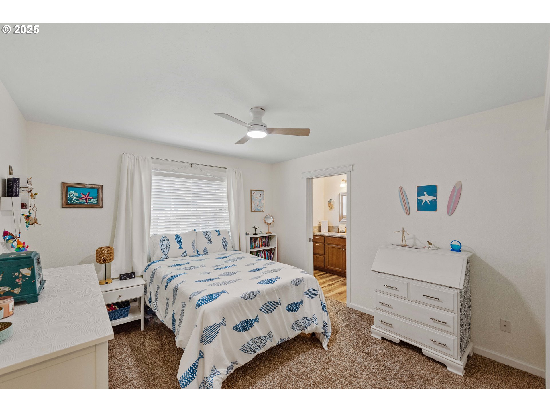 2669 Cedar Loop Bandon, OR 97411 - Photo 22 of 48 a bedroom with a bed and a dresser