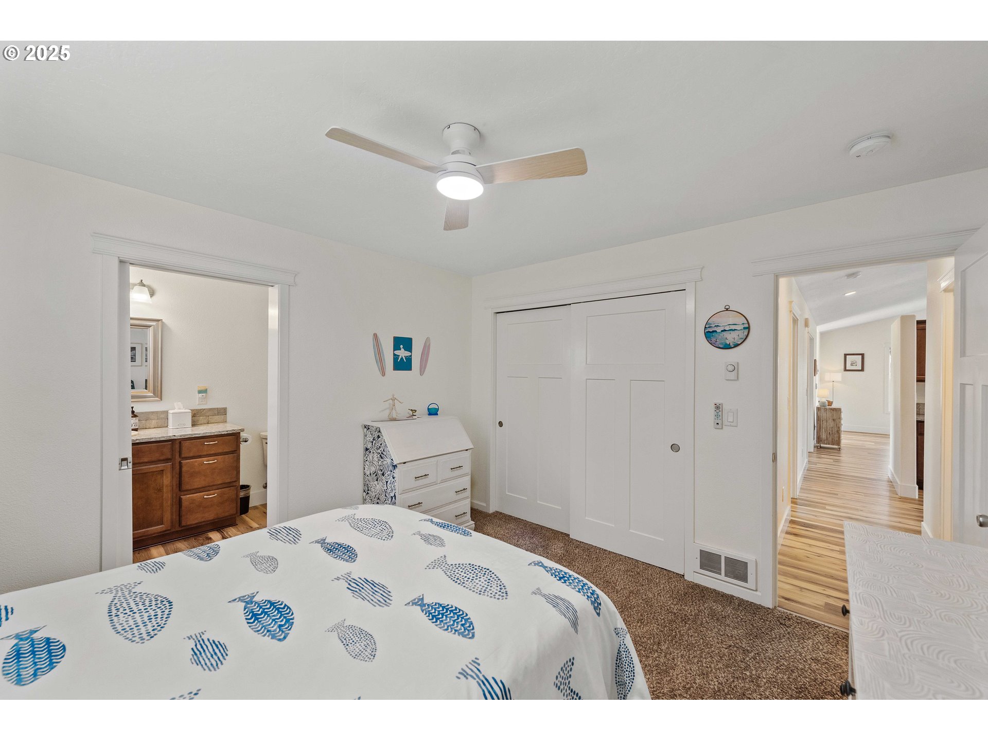 2669 Cedar Loop Bandon, OR 97411 - Photo 26 of 48 a bedroom with a bed and a dresser