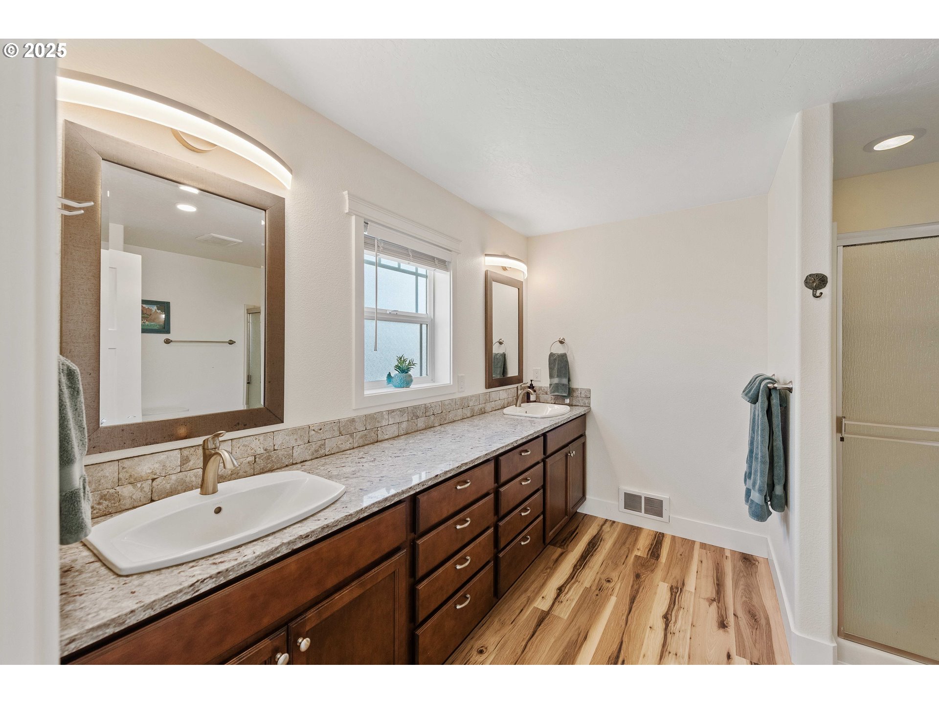 2669 Cedar Loop Bandon, OR 97411 - Photo 30 of 48 a bathroom with a sink double vanity granite and a mirror