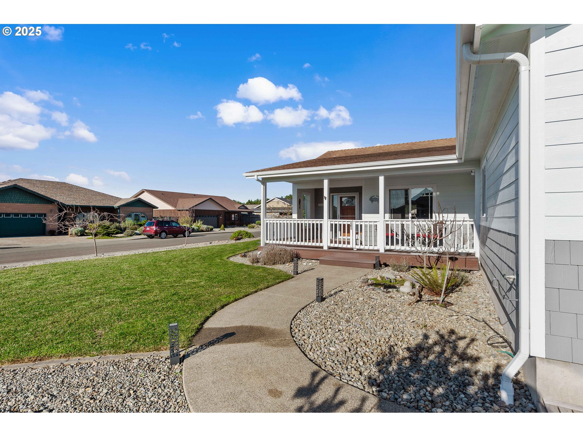 2669 Cedar Loop Bandon, OR 97411 - Photo 4 of 48 a view of an house with backyard porch and furniture