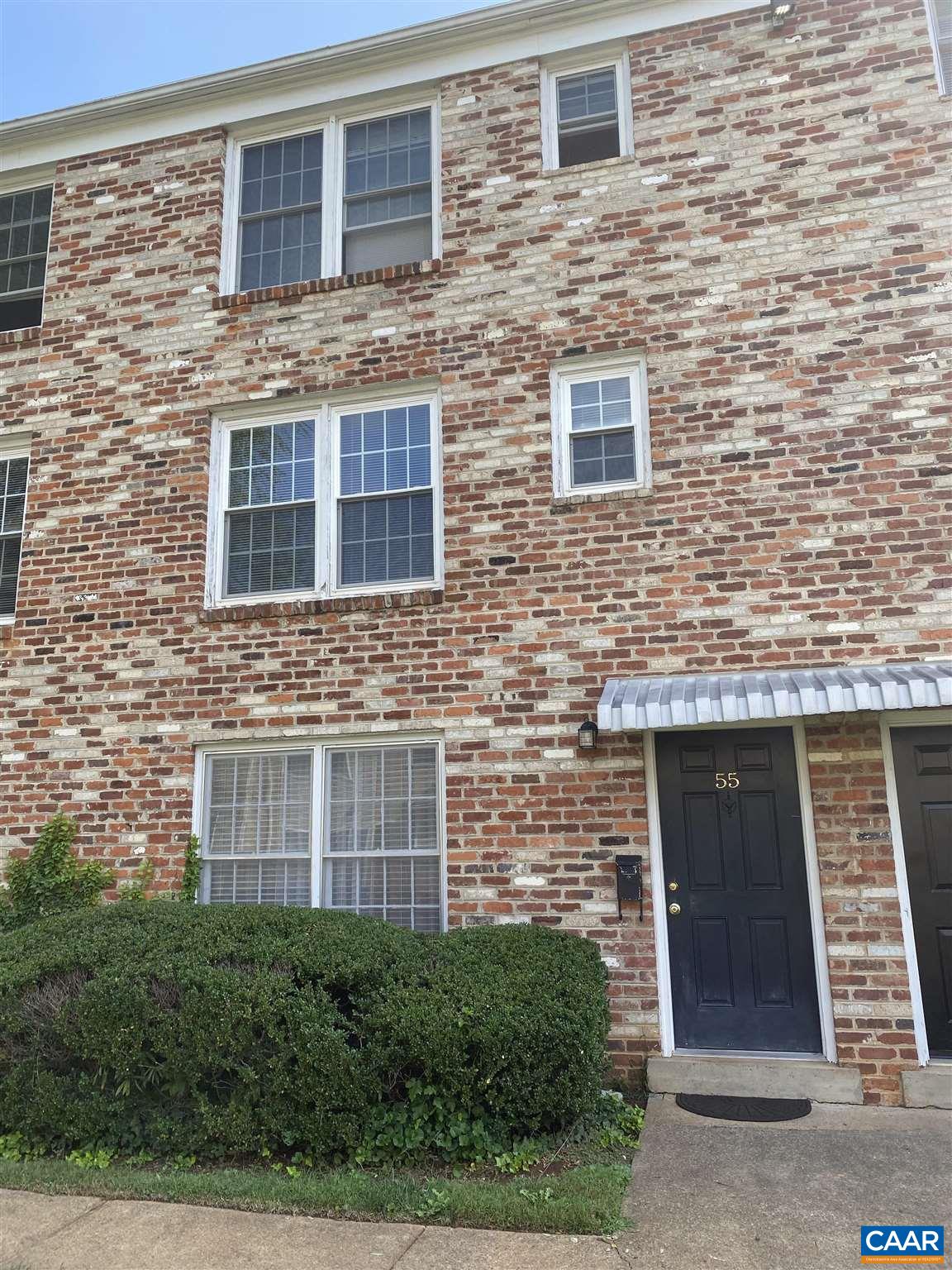 2527 Hydraulic Road, Unit 55 Charlottesville, VA 22901 - Photo 1 of 17 a brick building with a door and a windows