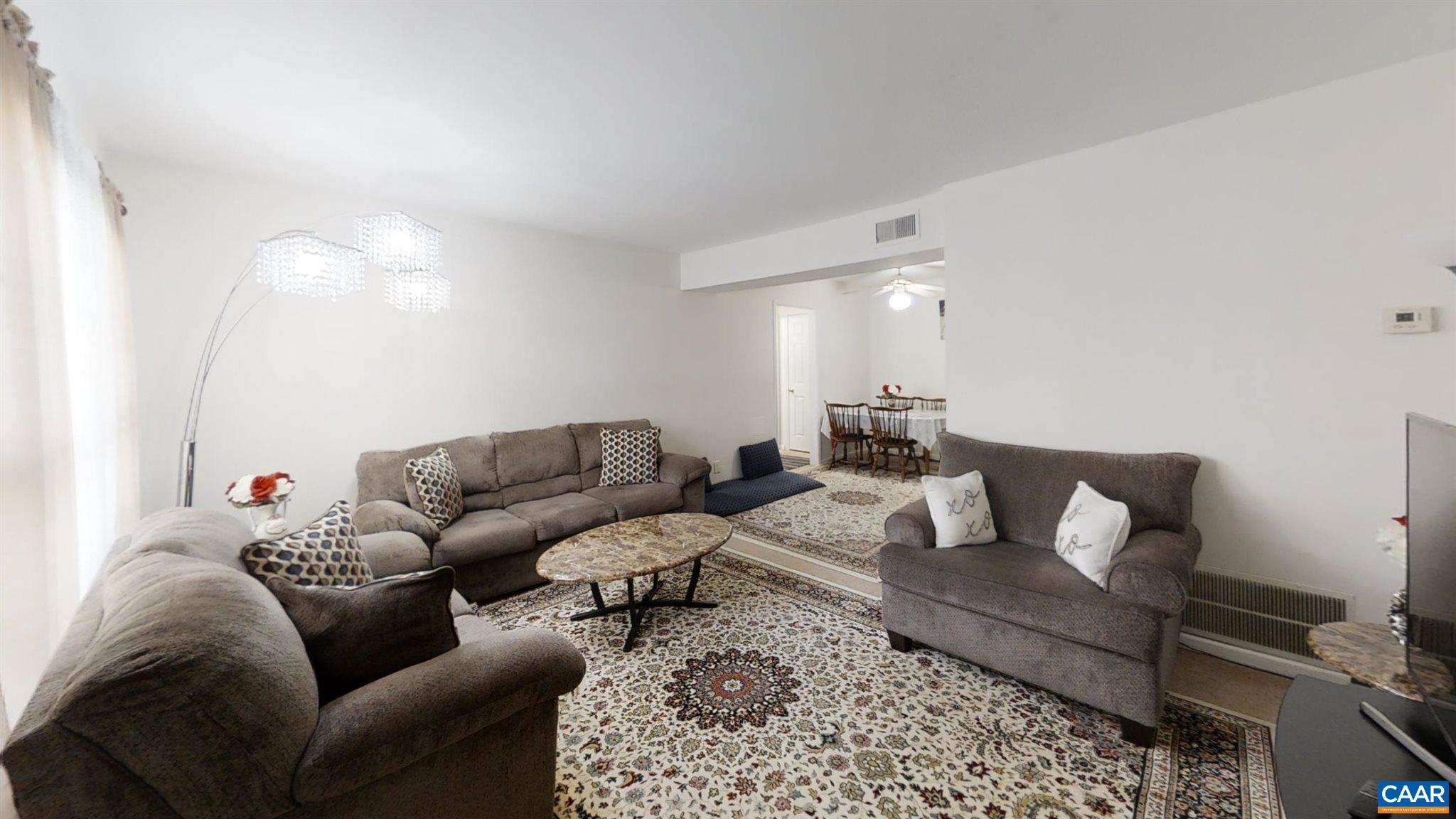 2527 Hydraulic Road, Unit 55 Charlottesville, VA 22901 - Photo 14 of 17 a living room with furniture and a couch