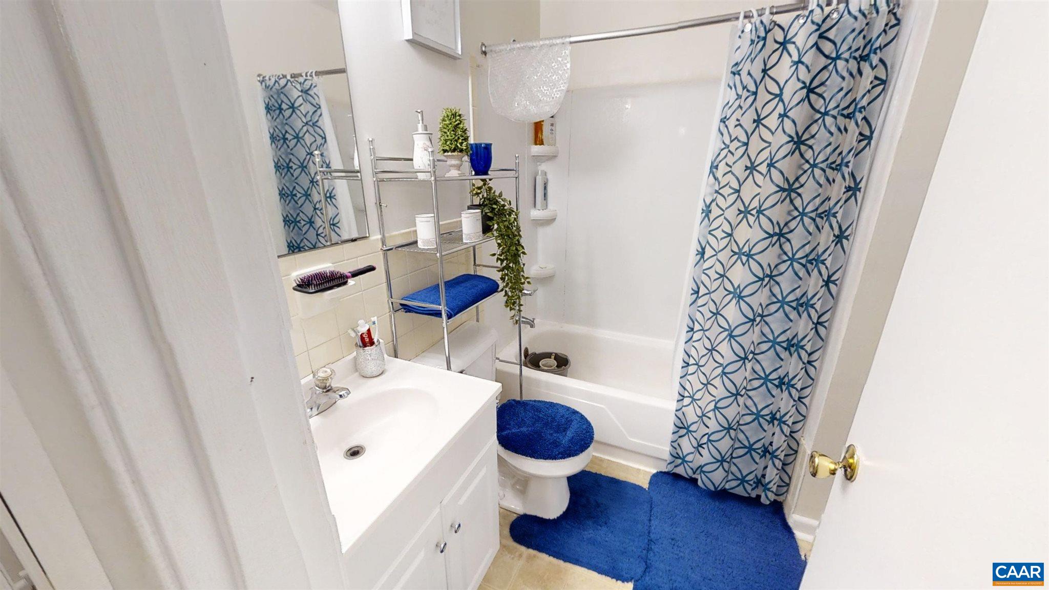 2527 Hydraulic Road, Unit 55 Charlottesville, VA 22901 - Photo 6 of 17 a bathroom with a sink toilet and shower