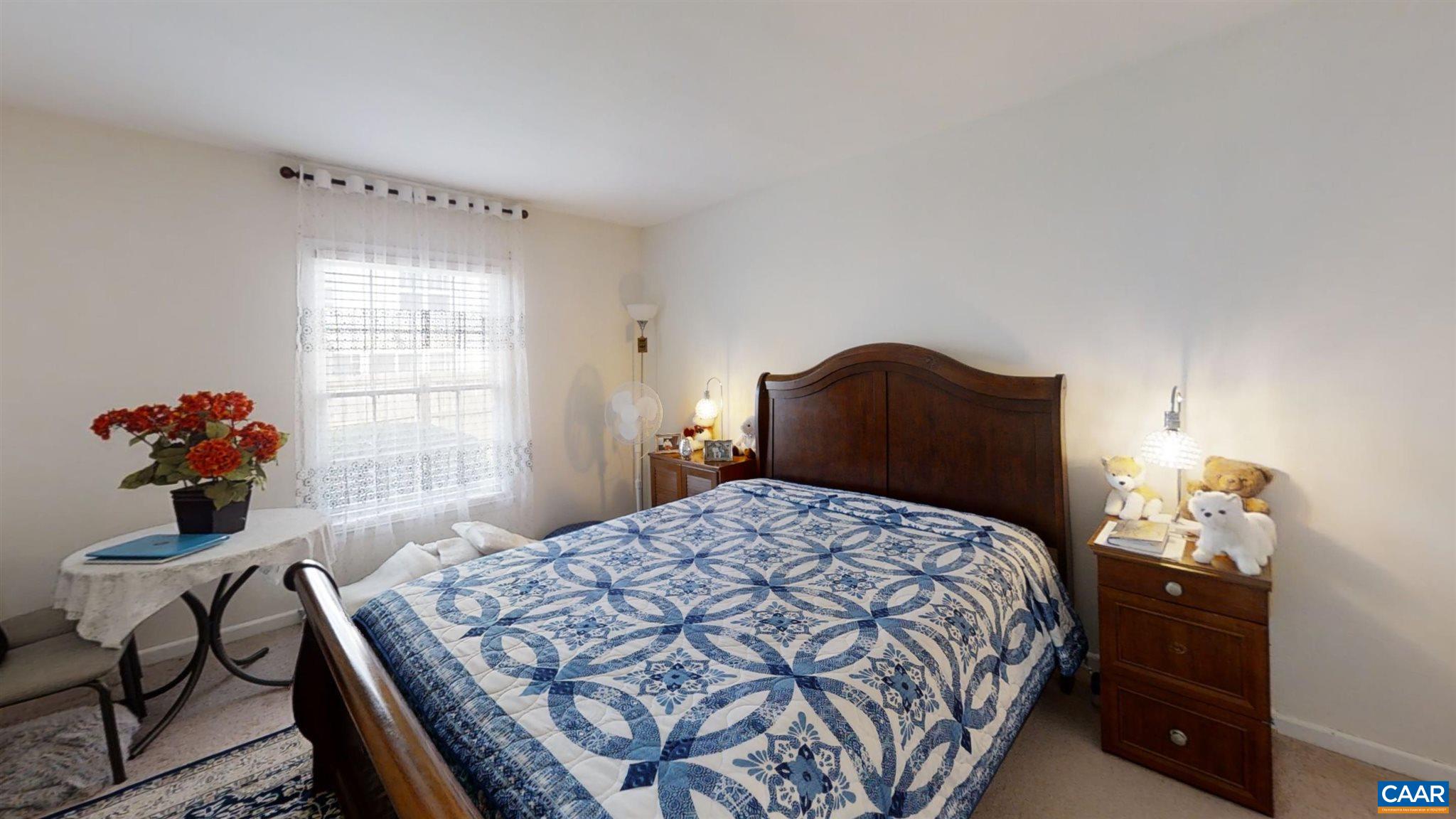 2527 Hydraulic Road, Unit 55 Charlottesville, VA 22901 - Photo 10 of 17 a bedroom with a bed and a dresser