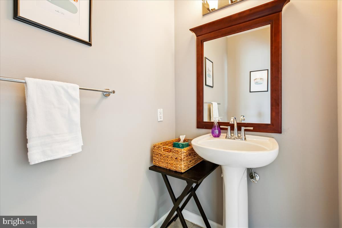 343 Cedar Street Northwest, Unit 323 Washington, DC 20012 - Photo 18 of 71 a bathroom with a sink and a mirror