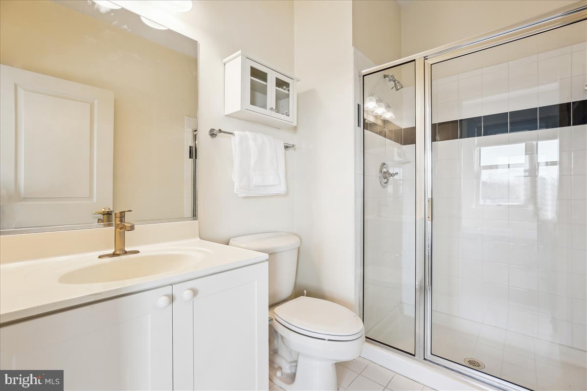 343 Cedar Street Northwest, Unit 323 Washington, DC 20012 - Photo 23 of 71 a bathroom with a sink toilet and shower