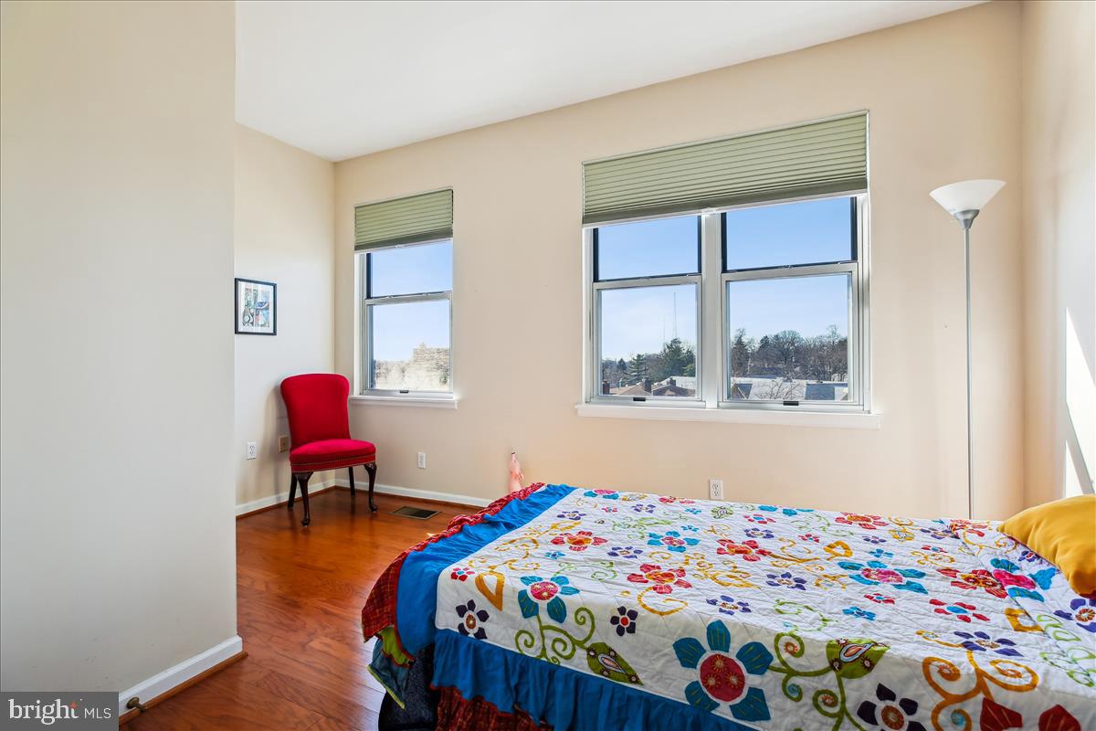 343 Cedar Street Northwest, Unit 323 Washington, DC 20012 - Photo 24 of 71 a bedroom with a bed and a window