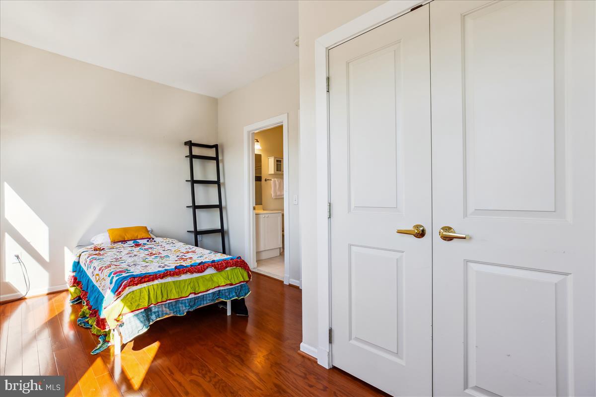343 Cedar Street Northwest, Unit 323 Washington, DC 20012 - Photo 26 of 71 a bedroom with a bed and a window