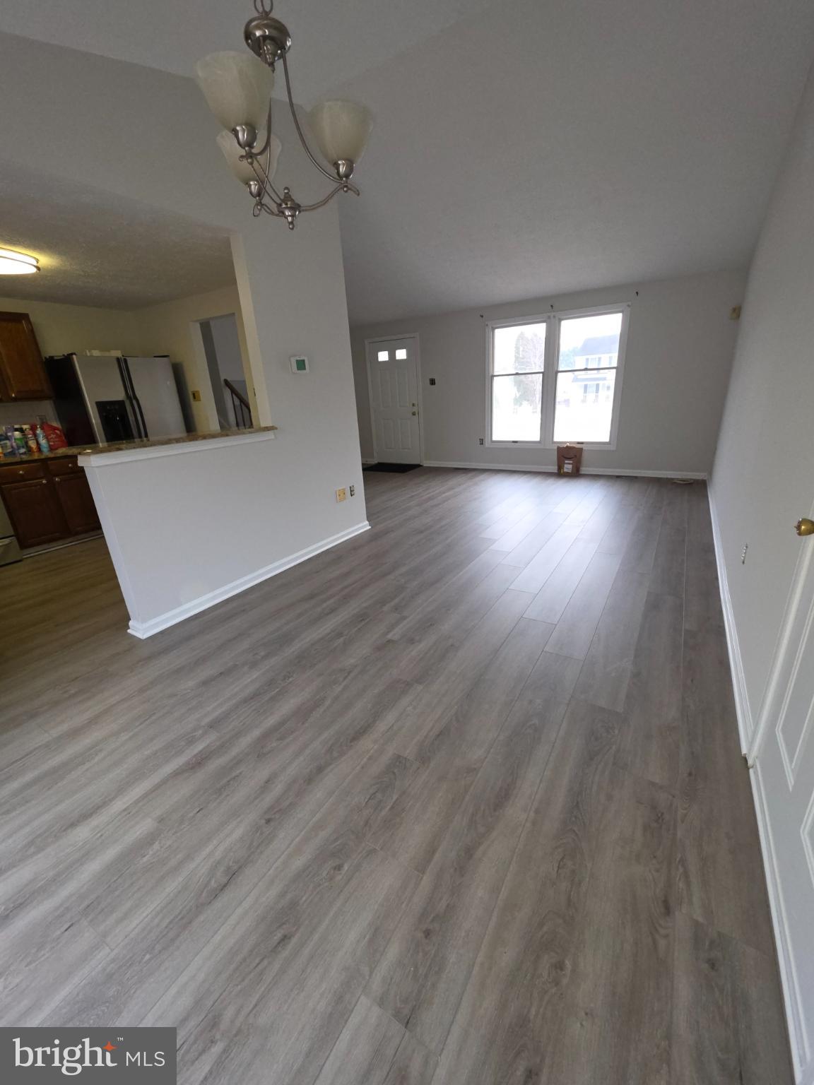 10854 Green View Way Columbia, MD 21044 - Photo 6 of 8 a view of a room with wooden floors and windows