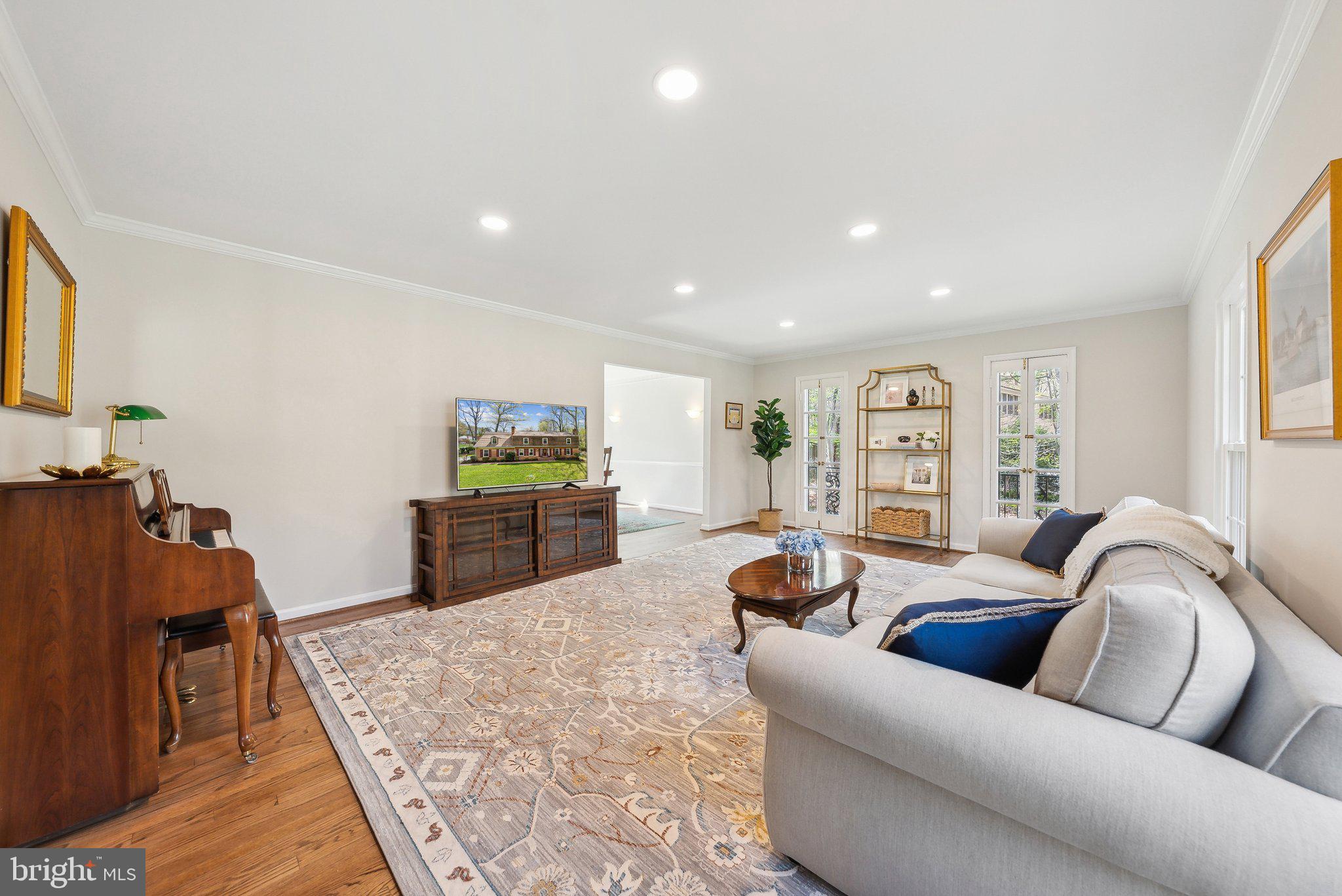 2623 Steeplechase Drive Reston, VA 20191 - Photo 19 of 69 a living room with furniture and a flat screen tv