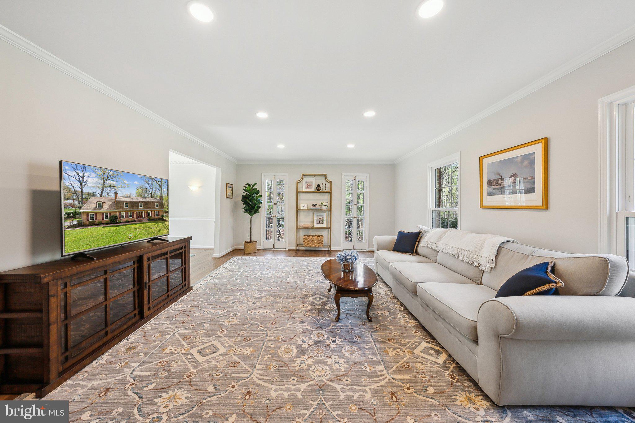 2623 Steeplechase Drive Reston, VA 20191 - Photo 20 of 69 a living room with furniture and a flat screen tv