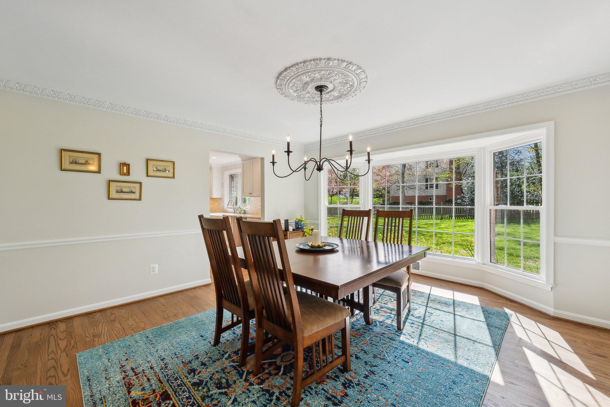 2623 Steeplechase Drive Reston, VA 20191 - Photo 21 of 69 a dining room with furniture a chandelier and wooden floor