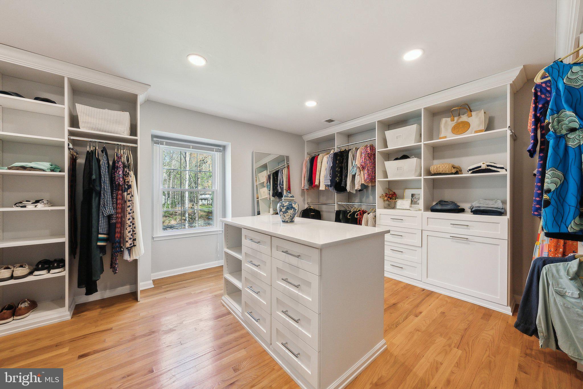 2623 Steeplechase Drive Reston, VA 20191 - Photo 31 of 69 a kitchen with stainless steel appliances white cabinets and wooden floor