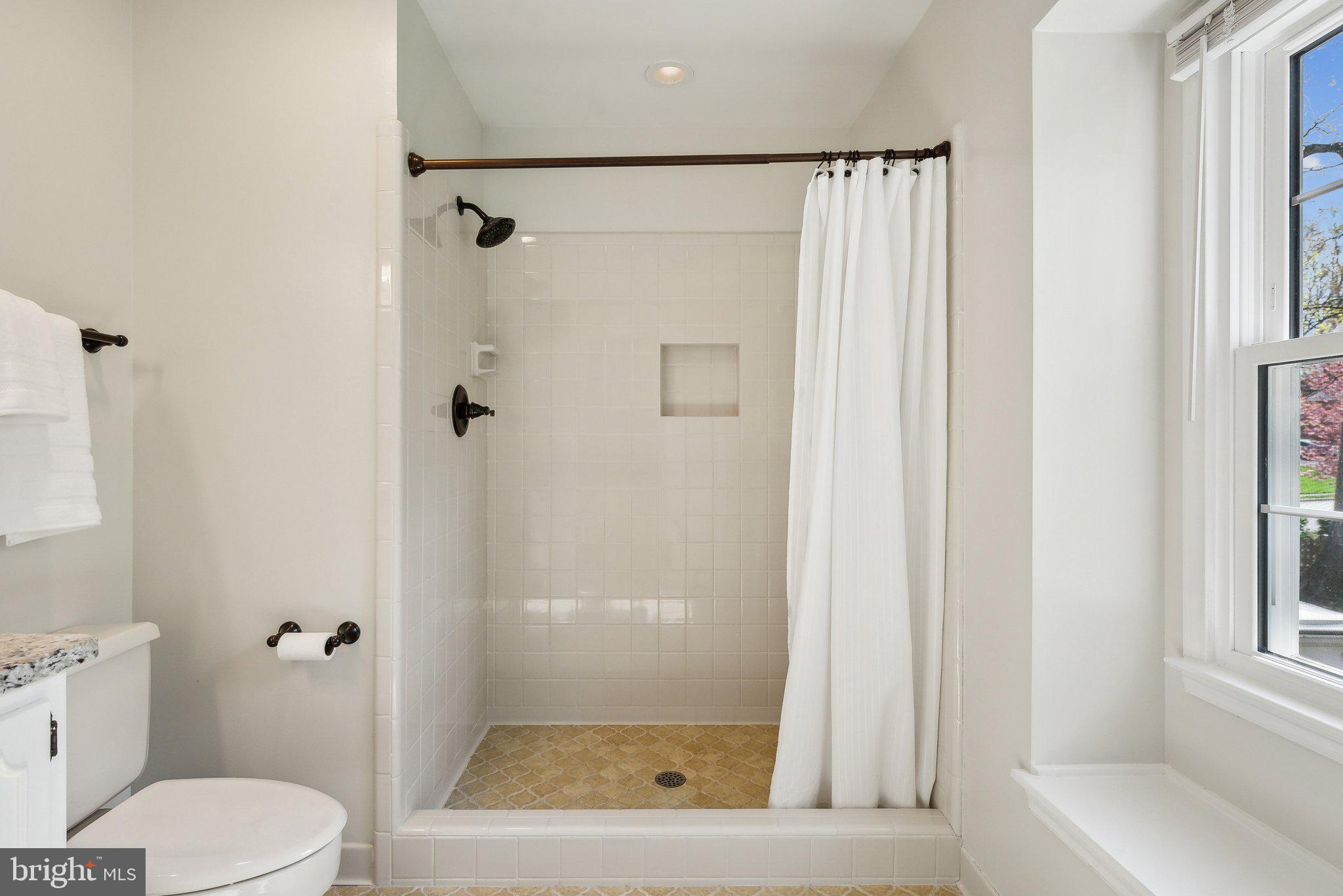 2623 Steeplechase Drive Reston, VA 20191 - Photo 37 of 69 a bathroom with a shower and a toilet