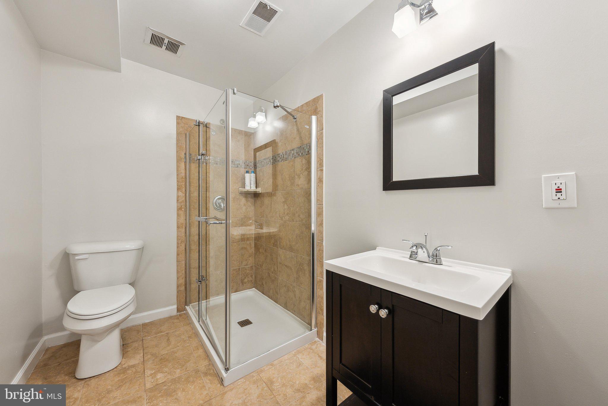 2623 Steeplechase Drive Reston, VA 20191 - Photo 38 of 69 a bathroom with a toilet sink shower and mirror