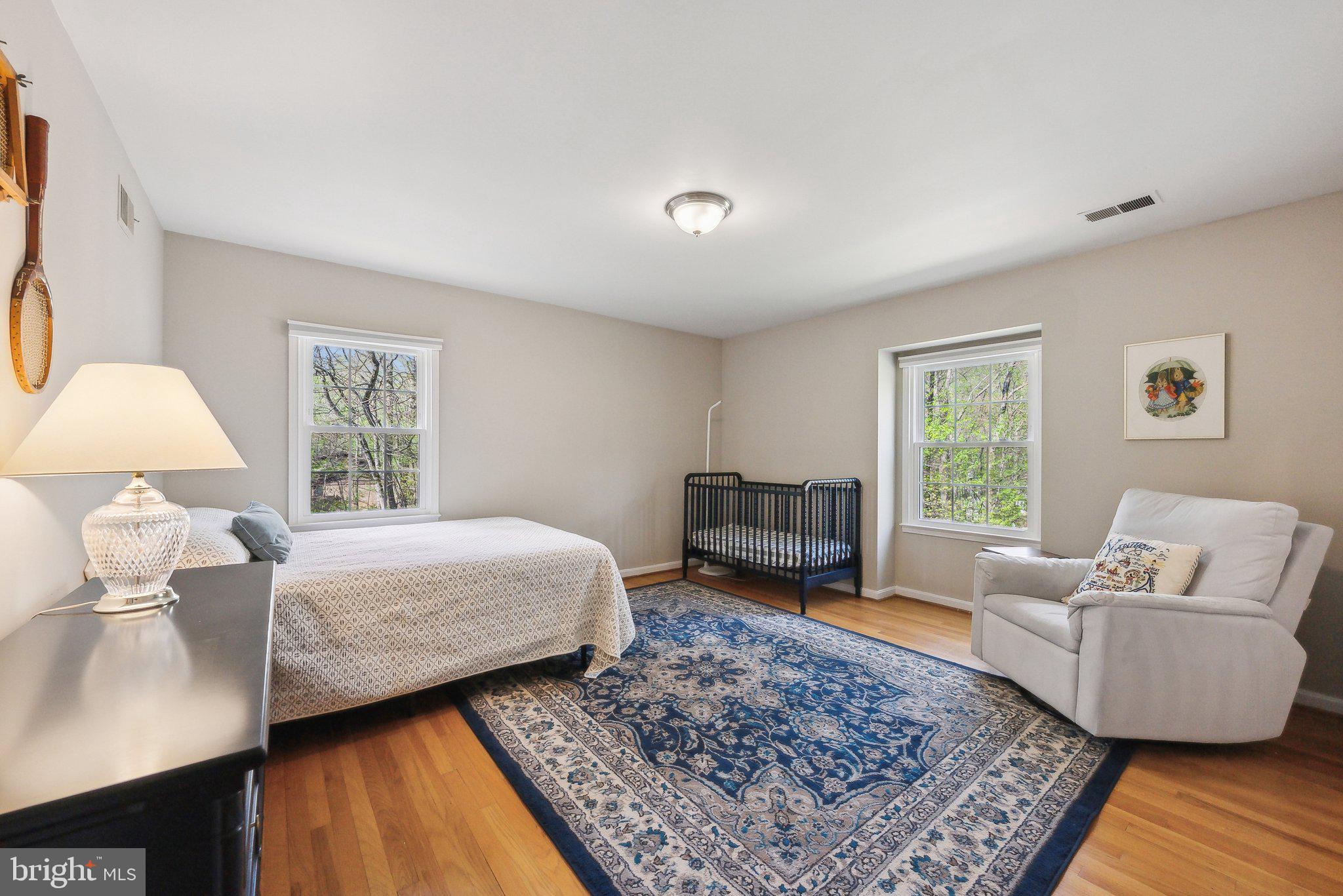 2623 Steeplechase Drive Reston, VA 20191 - Photo 41 of 69 a bedroom with a bed a couch and a window