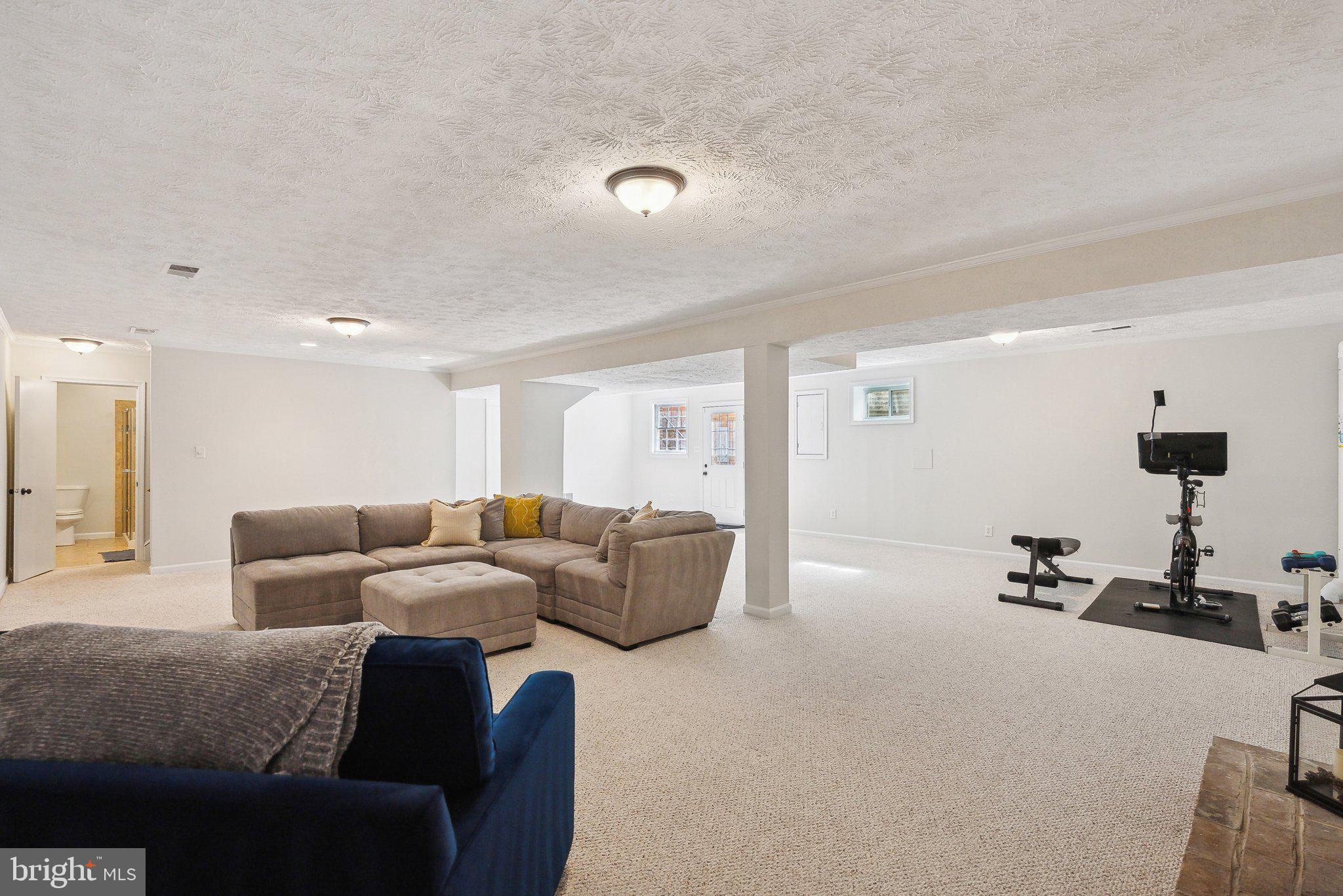 2623 Steeplechase Drive Reston, VA 20191 - Photo 49 of 69 a living room with furniture and a mirror