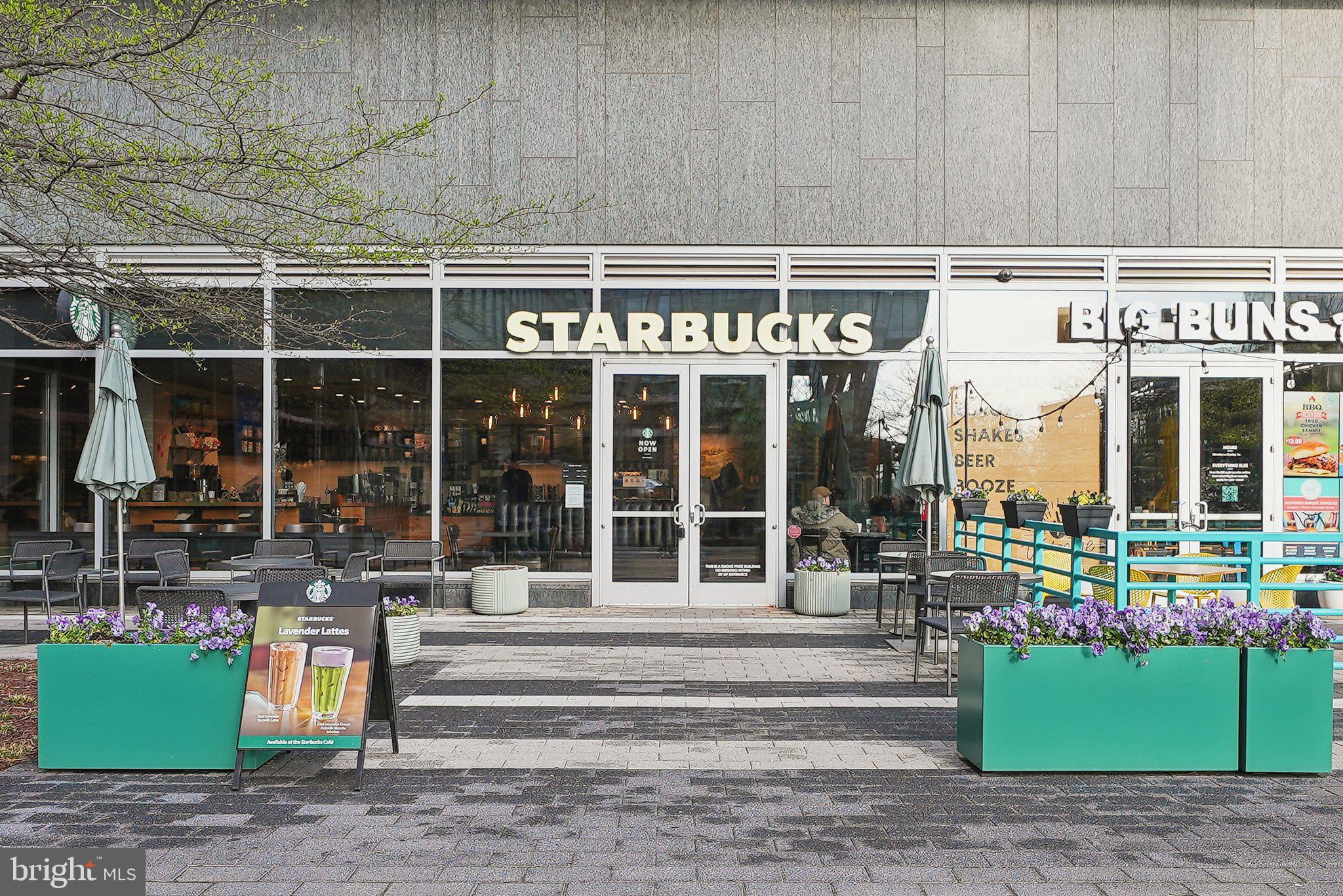 2623 Steeplechase Drive Reston, VA 20191 - Photo 62 of 69 a front view of a building with a garden and plants