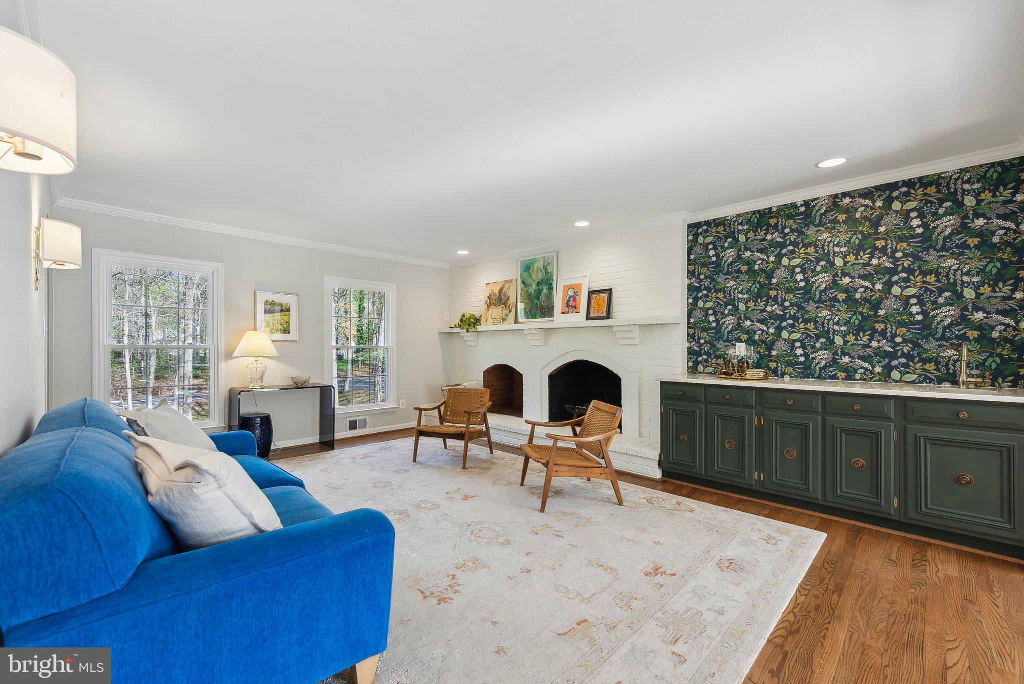 2623 Steeplechase Drive Reston, VA 20191 - Photo 8 of 69 a living room with furniture a fireplace and a table