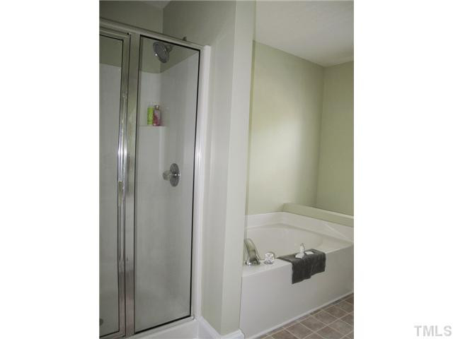 427 Saddle Ridge Drive Willow Spring, NC 27592 - Photo 12 of 19 a bathroom with a shower and a tub