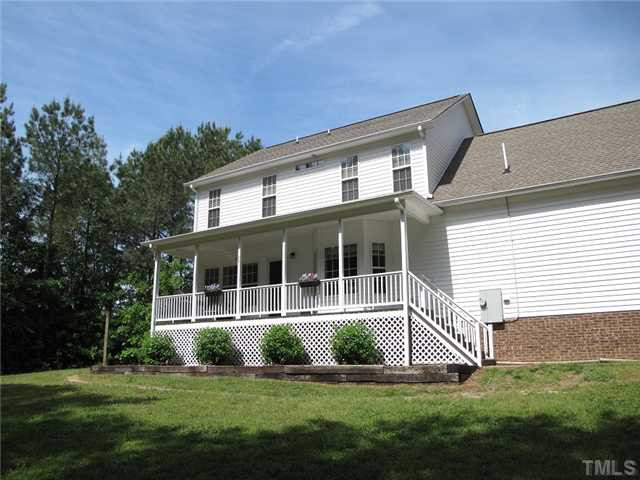 427 Saddle Ridge Drive Willow Spring, NC 27592 - Photo 18 of 19 a front view of a house with a yard