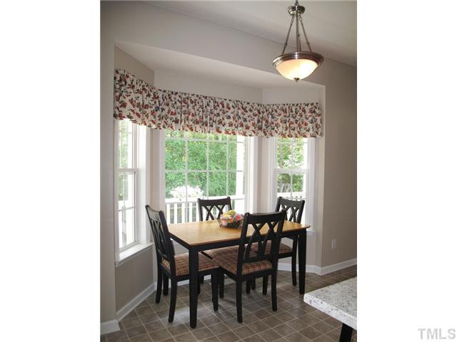 427 Saddle Ridge Drive Willow Spring, NC 27592 - Photo 9 of 19 a view of a dining room with furniture window and outside view