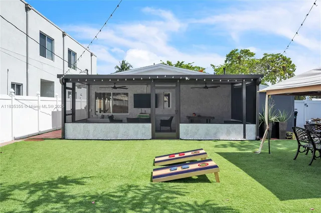 a front view of house with a garden and patio