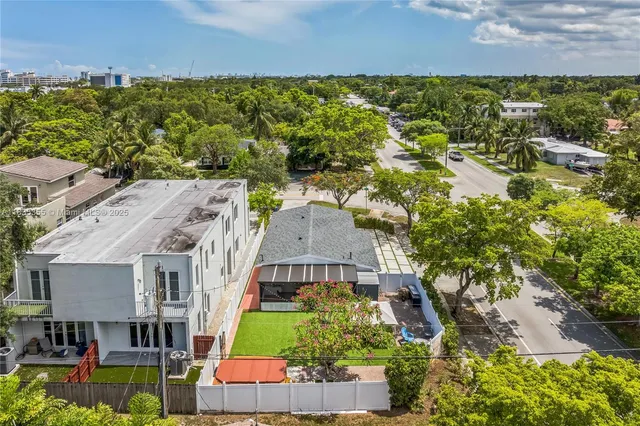 an aerial view of a house with a garden