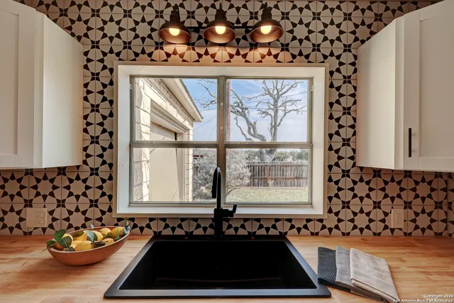 a view of a entryway door of the house and wooden floor