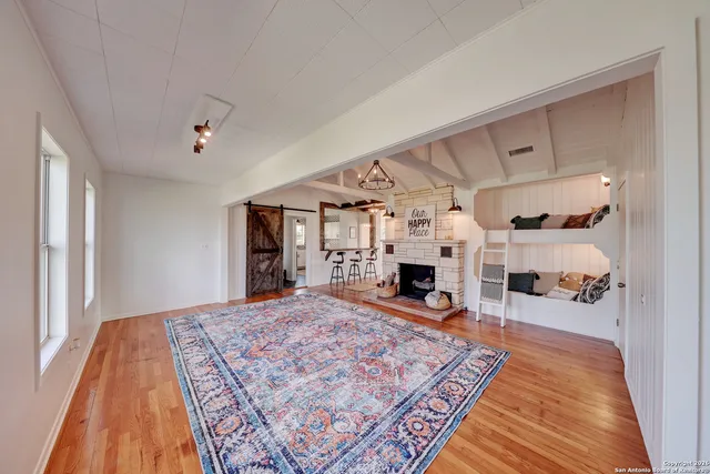 a view of a living room and a rug