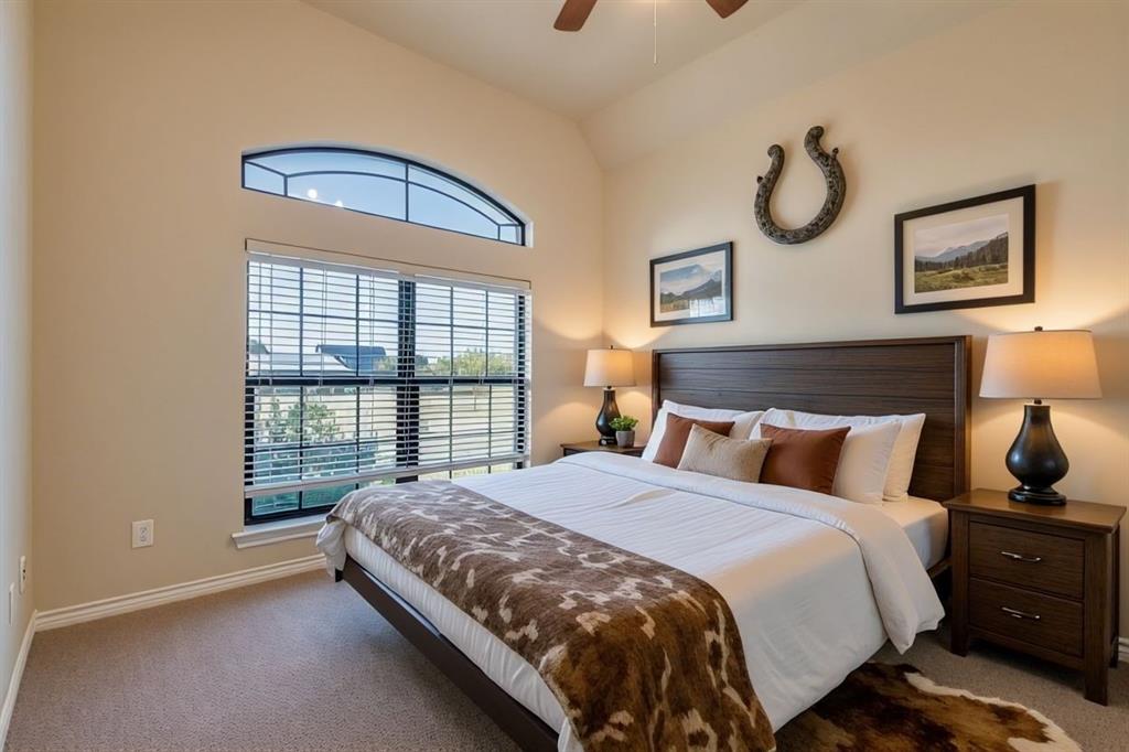 6025 Ge Horton Road Justin, TX 76247 - Photo 7 of 40 Carpeted bedroom featuring a ceiling fan and vaulted ceiling