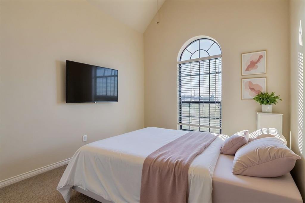 6025 Ge Horton Road Justin, TX 76247 - Photo 8 of 40 Carpeted bedroom featuring vaulted ceiling and baseboards