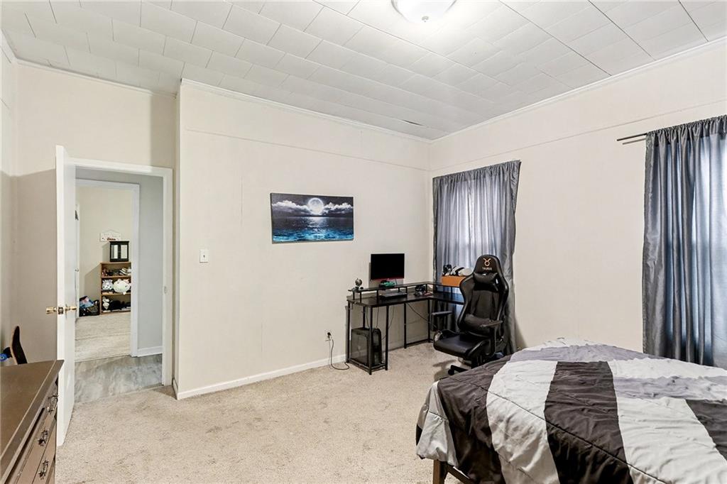 48 Maple Street Grantville, GA 30220 - Photo 17 of 26 a view of a livingroom with workspace and a window