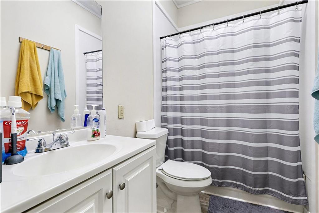 48 Maple Street Grantville, GA 30220 - Photo 19 of 26 a bathroom with a sink and a mirror