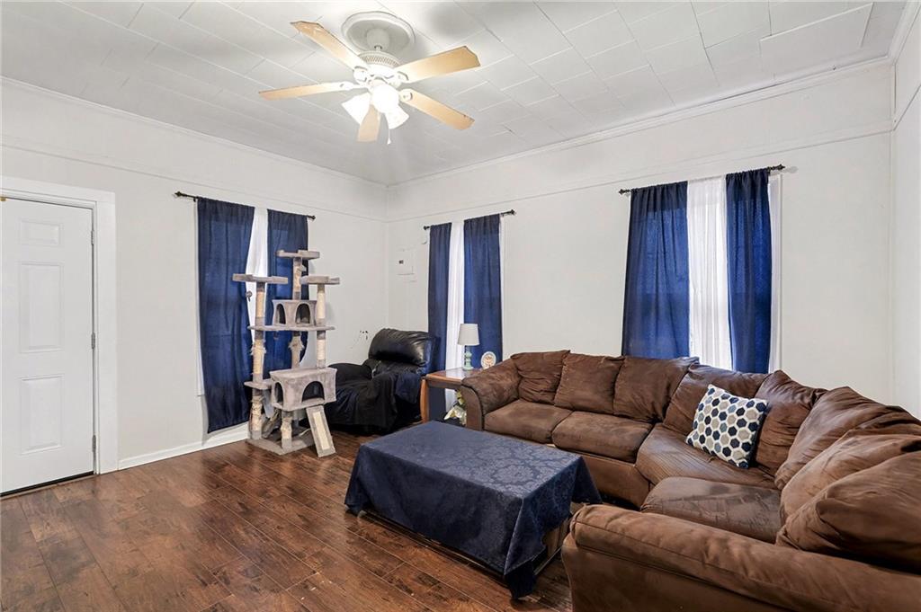 48 Maple Street Grantville, GA 30220 - Photo 4 of 26 a living room with furniture a ceiling fan and a rug