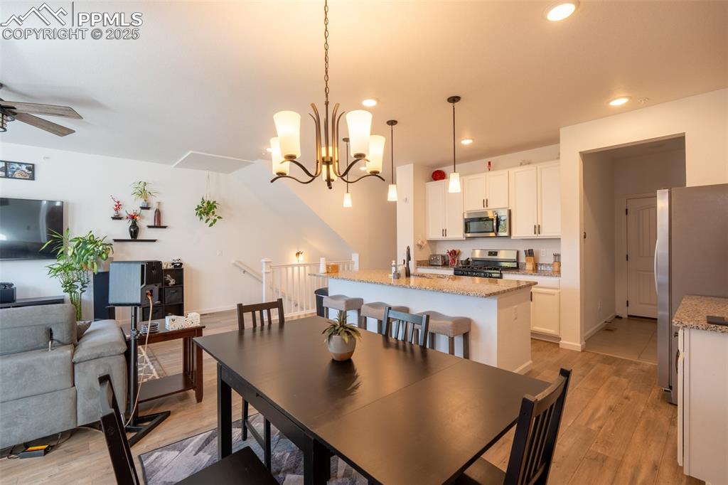 15619 Kitchener Way Monument, CO 80132 - Photo 14 of 40 a large kitchen with a table and chairs