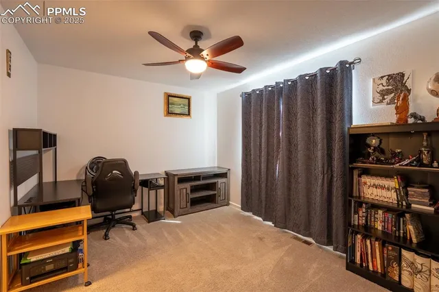 a bedroom with a workspace