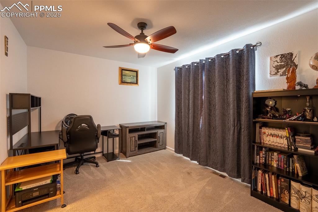 15619 Kitchener Way Monument, CO 80132 - Photo 18 of 40 a bedroom with a workspace