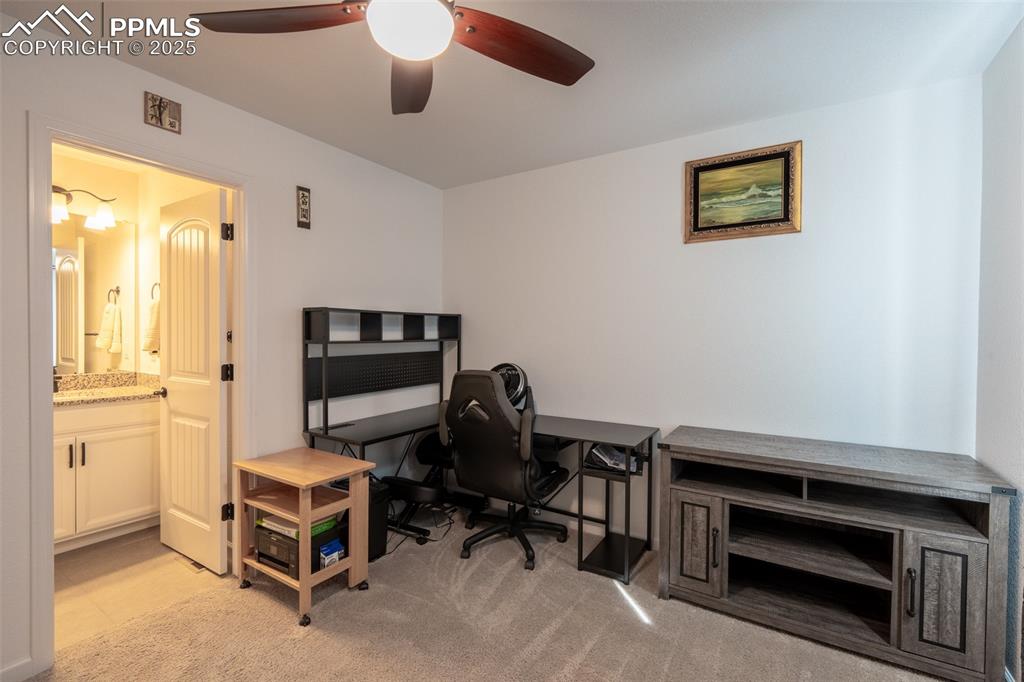 15619 Kitchener Way Monument, CO 80132 - Photo 19 of 40 a view of a workspace with furniture and a window