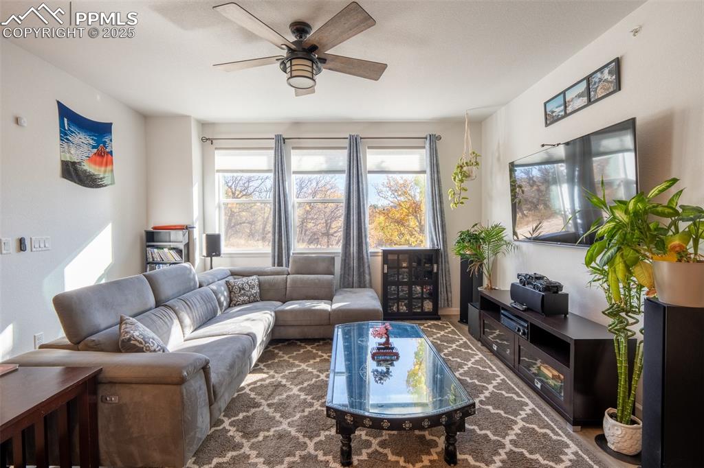 15619 Kitchener Way Monument, CO 80132 - Photo 3 of 40 a living room with furniture and a large window