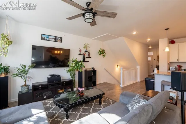 a living room with furniture and a flat screen tv