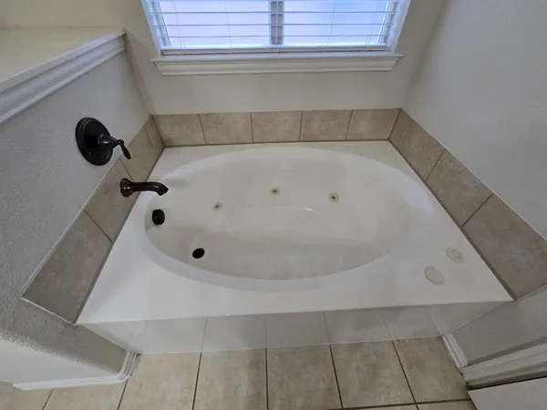 a bathroom with a sink vanity and a mirror