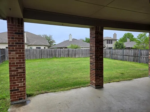 a view of a house with a yard and a big yard