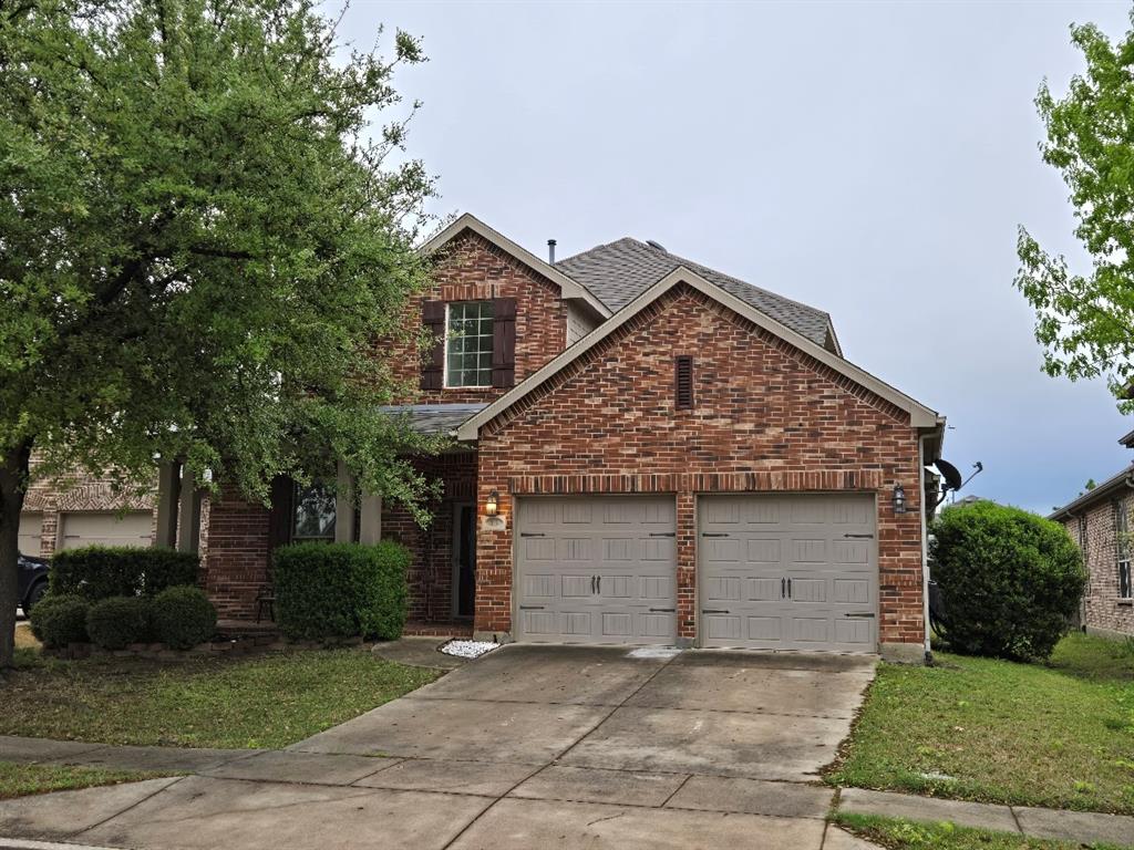 213 Willet Court Little Elm, TX 75068 - Photo 27 of 28 Traditional home featuring an attached garage, driveway, and brick siding