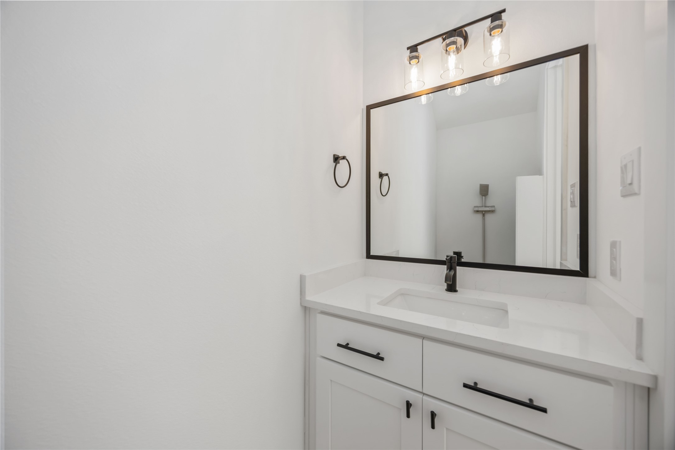 1466 Ferguson Way, Unit B Houston, TX 77088 - Photo 14 of 28 a bathroom with a sink and a mirror