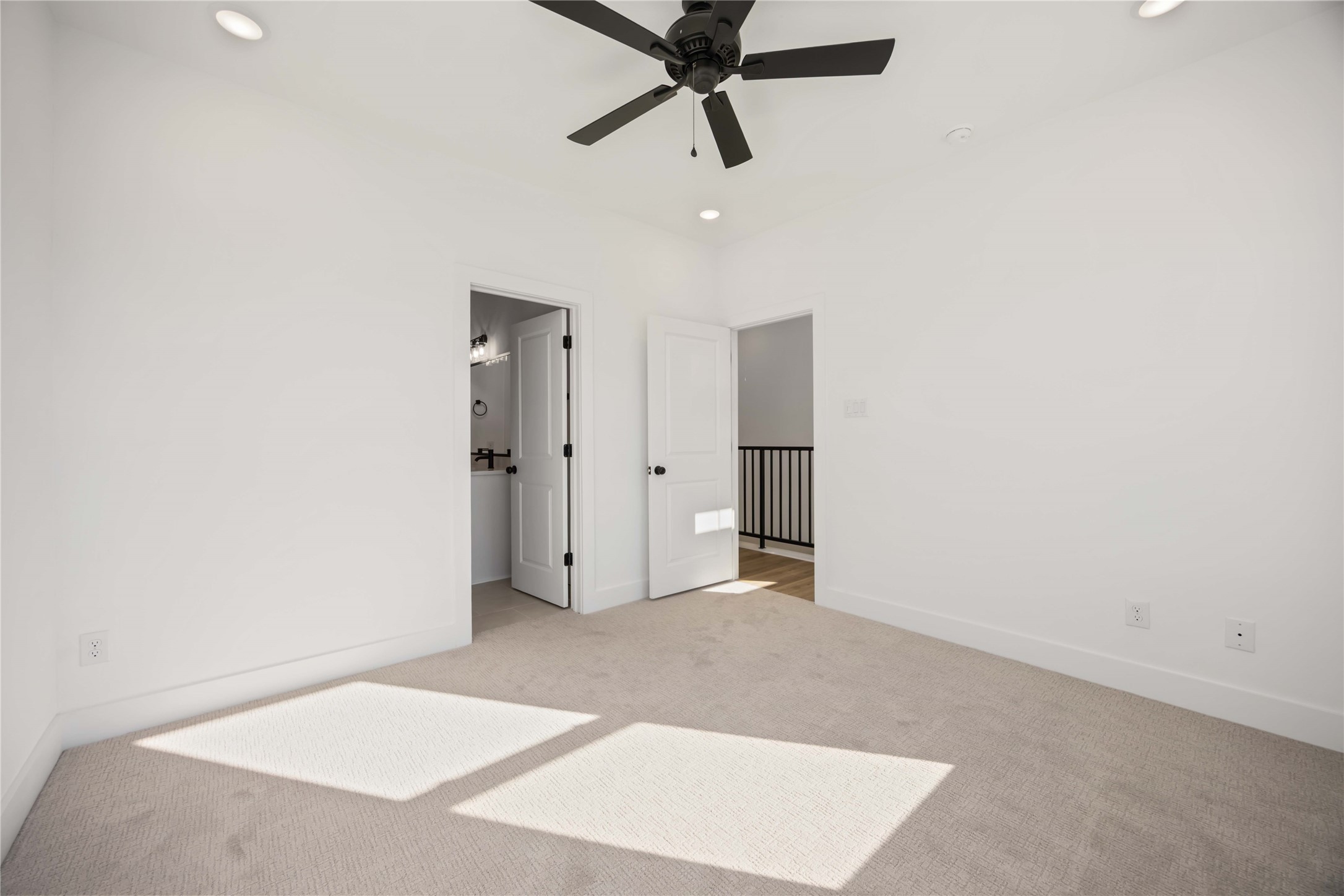 1466 Ferguson Way, Unit B Houston, TX 77088 - Photo 17 of 28 a view of a big room with closet and ceiling fan