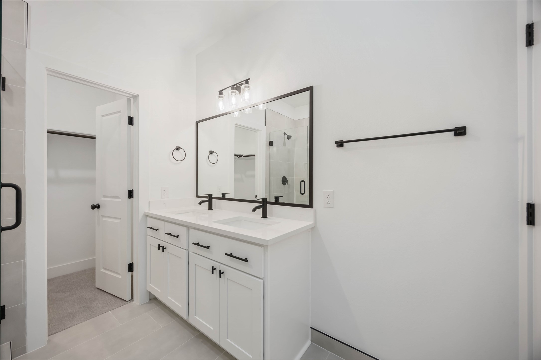 1466 Ferguson Way, Unit B Houston, TX 77088 - Photo 19 of 28 a bathroom with a double vanity sink mirror and shower