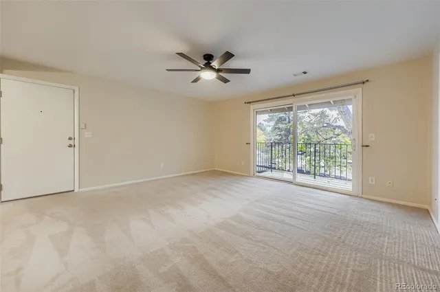 a view of an empty room with a window