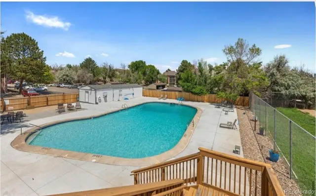 a room with wooden table table tennis table and windows